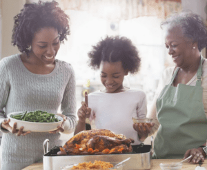 Three generations of women prepare food